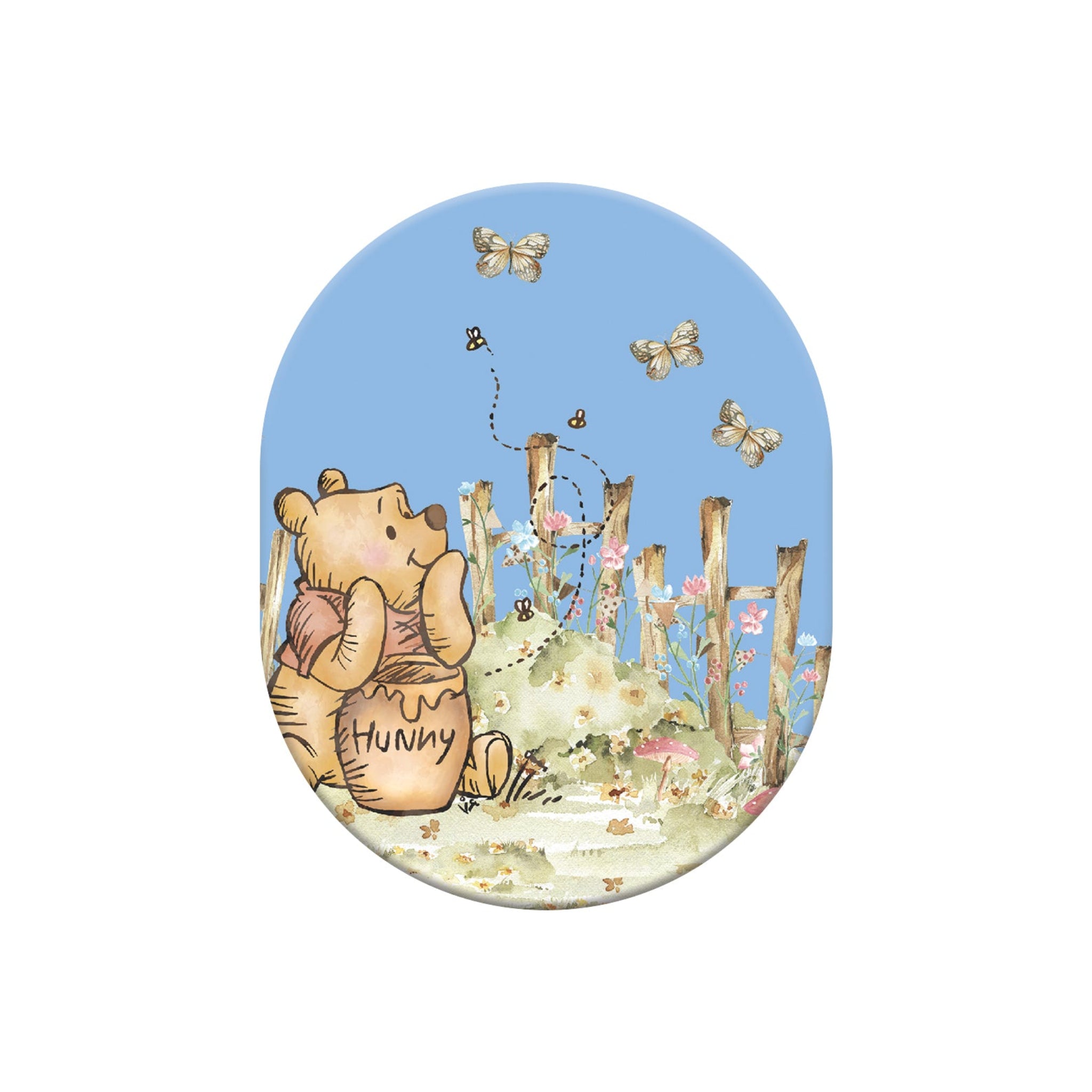 Oval-shaped magnet with a cartoon bear holding a honey pot and flowers on a blue background.