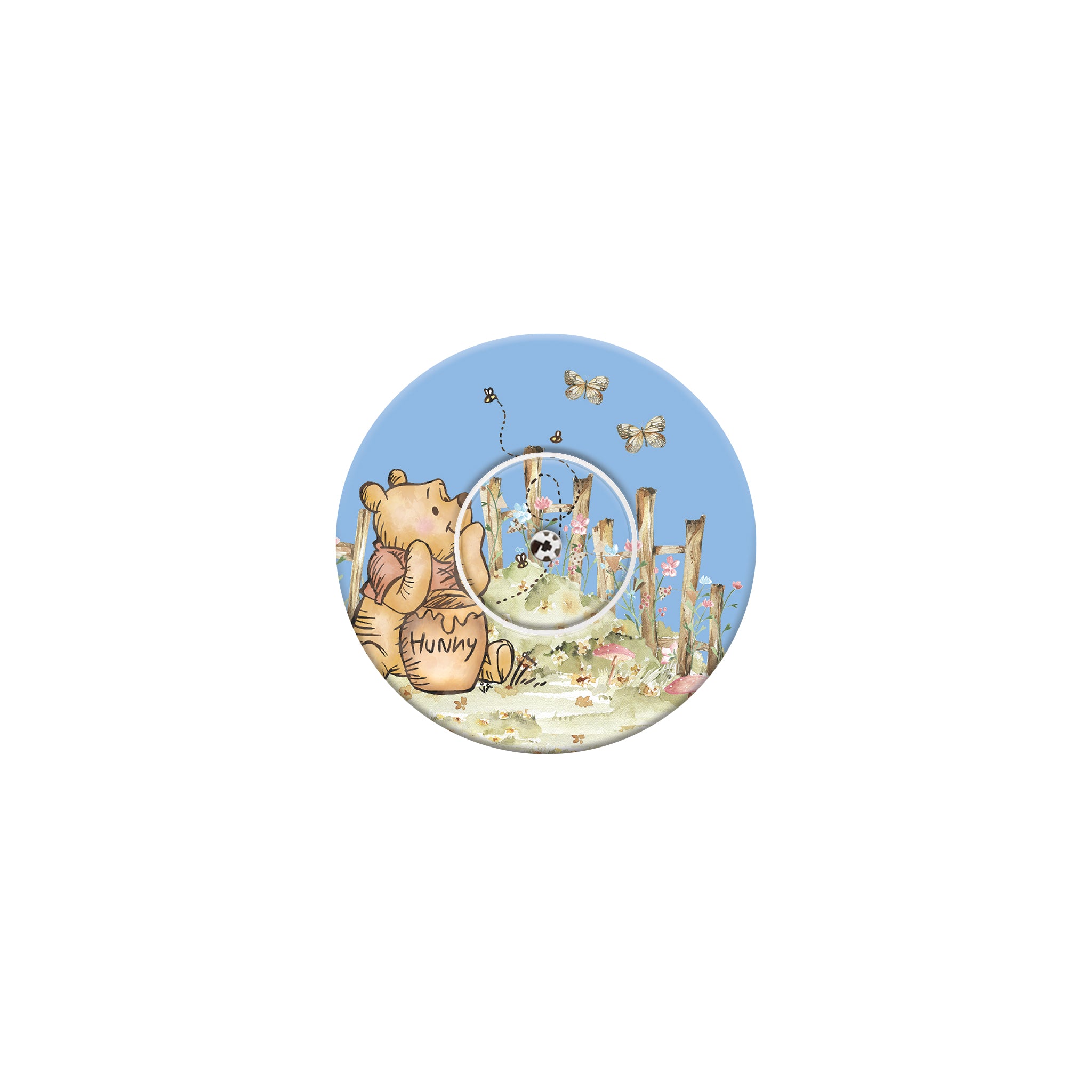 Circular design with a bear holding a honey pot and flowers on a blue background