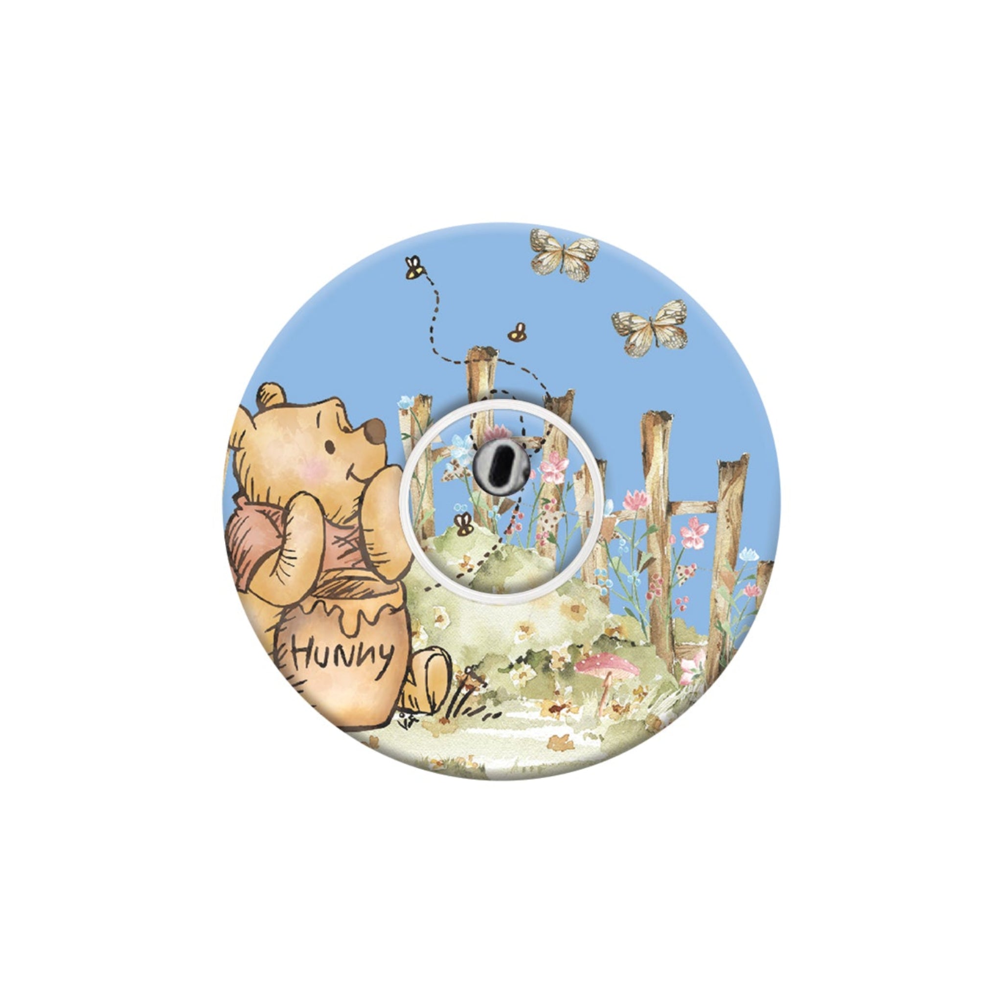 Circular design with a bear holding a honey pot and flowers on a white background
