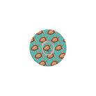 Circular product with turtle pattern on a turquoise background