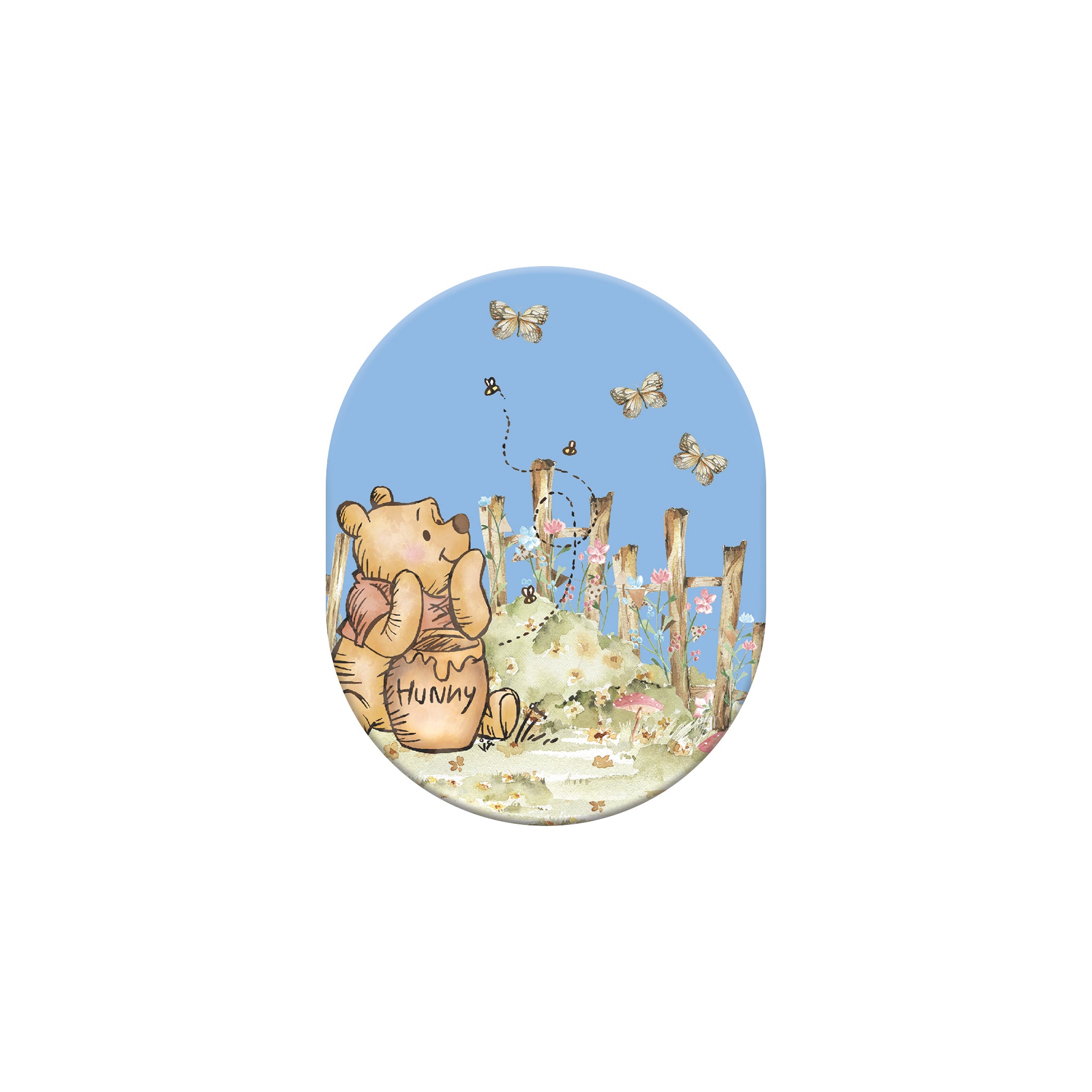 Oval-shaped magnet with a cartoon bear holding a honey pot and flowers on a blue background.