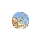 Circular sticker with a cartoon bear and flowers on a white background