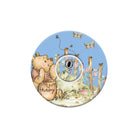 Circular design with a bear holding a honey pot and flowers on a white background