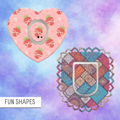 Heart-shaped pink object with strawberry pattern and a colorful geometric design on a multicolored background.